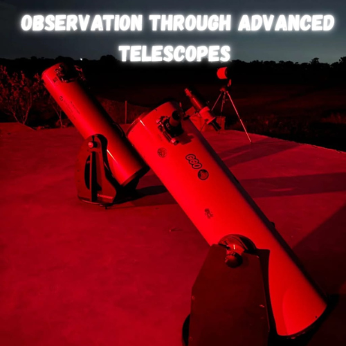 Dobsonian telescopes set up for night observation under red light